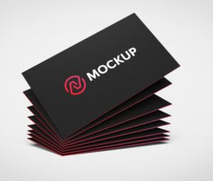 Stack of premium laminated business cards with a black matte finish and red edges, showcasing a mockup logo. Ideal for professional branding.