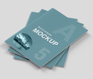 Stack of professional A5 hard cover booklet mockups with a teal cover, ideal for compact brochures or guides.