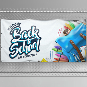 A vinyl banner for "Back to School" event, featuring colorful text and school supplies like crayons and backpack