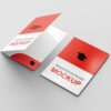 Red and white glued presentation folders with a graduation cap illustration for professional and academic documents.