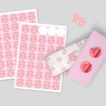 Customizable pink circle stickers with a donut logo, showcasing different size sheets and a product box mock-up for branding.